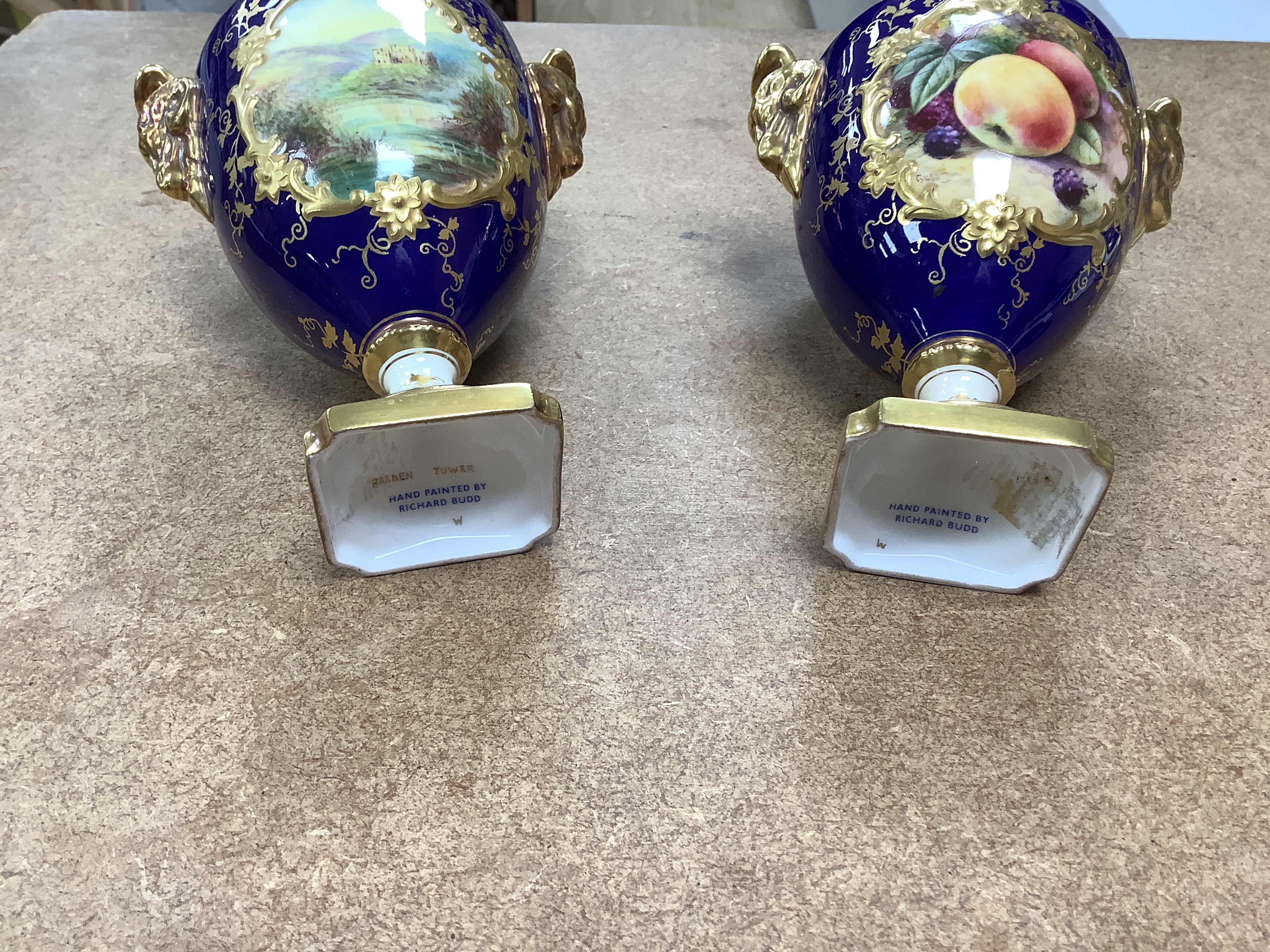 A pair of Coalport vases and covers and a pair of Staffordshire deer spill vases, largest 29cm high